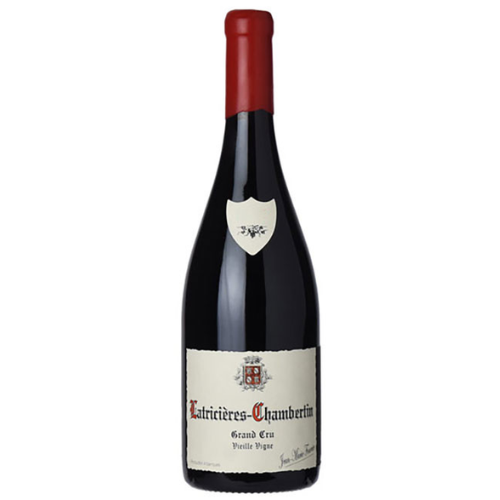A bottle of Jean-Marie Fourrier 2020 Latricières-Chambertin Vieille Vigne Grand Cru, featuring an off-white label with ornate gothic red and black script, a family crest emblem, and a wax-dipped red capsule.
